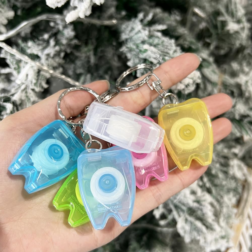 Travel-friendly dental floss keychain in hand