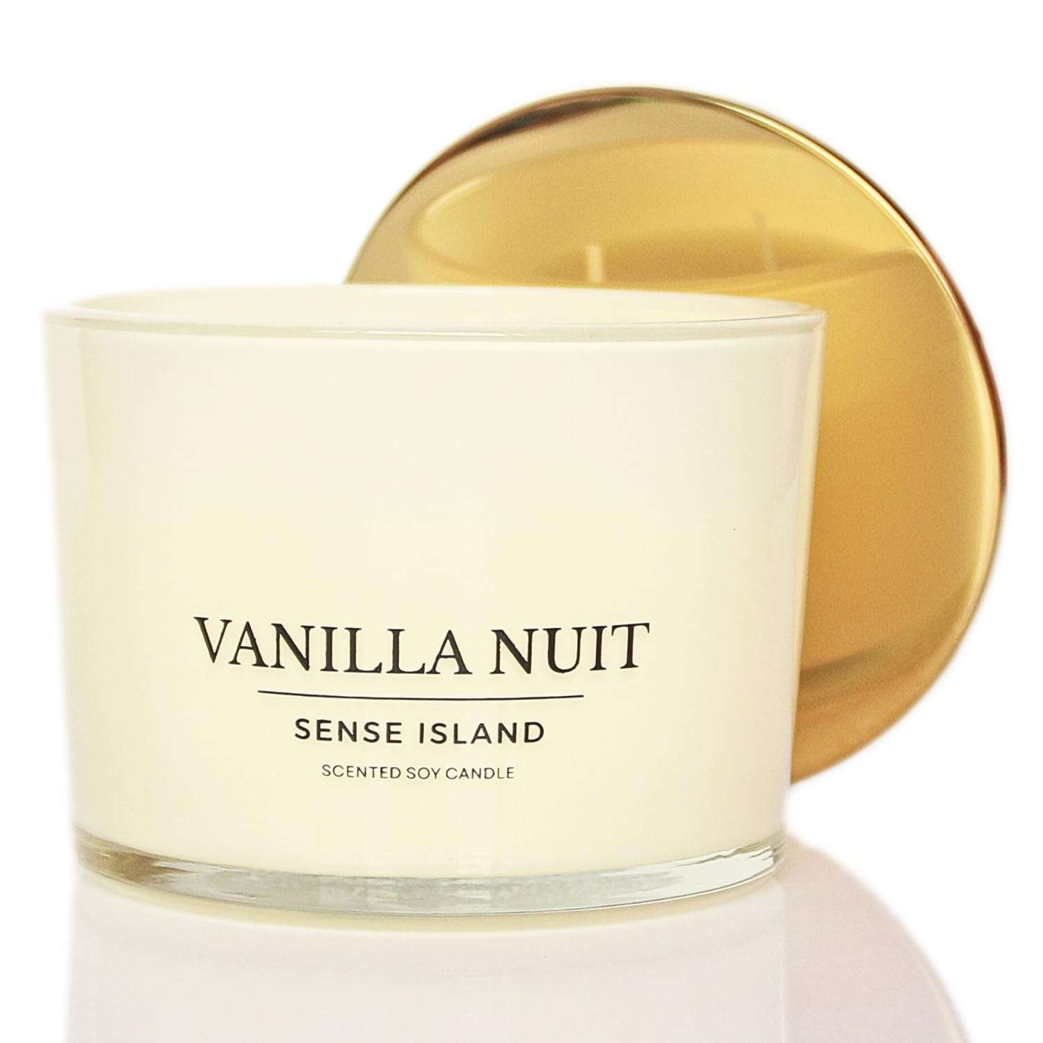 Sense Island Vanilla Nuit 3-Wick candle in a cozy room promotes relaxing ambiance.