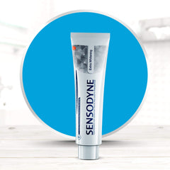 Lifestyle shot with toothpaste on a toothbrush and mint leaves