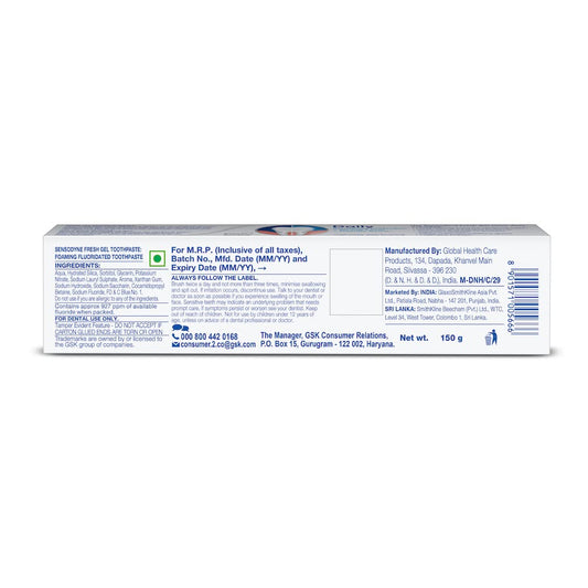 Close up of blue gel toothpaste being squeezed from the tube