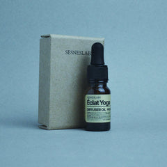 Boxed SesnesLabs Éclat Yoga Diffuser Oil displayed with a calm yoga setting