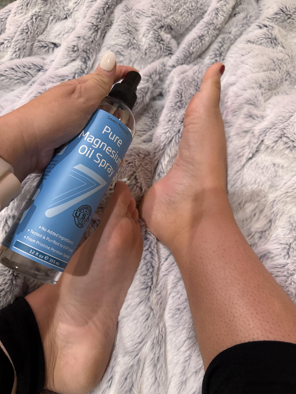 Lifestyle image of magnesium oil spray use for cramps or headaches