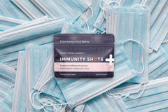 Vegan, gluten-free immunity gummies in glass bottle on table