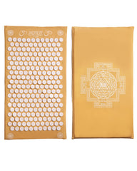 ShaktiMat Classic Acupressure Mat in yellow with light intensity on a white surface