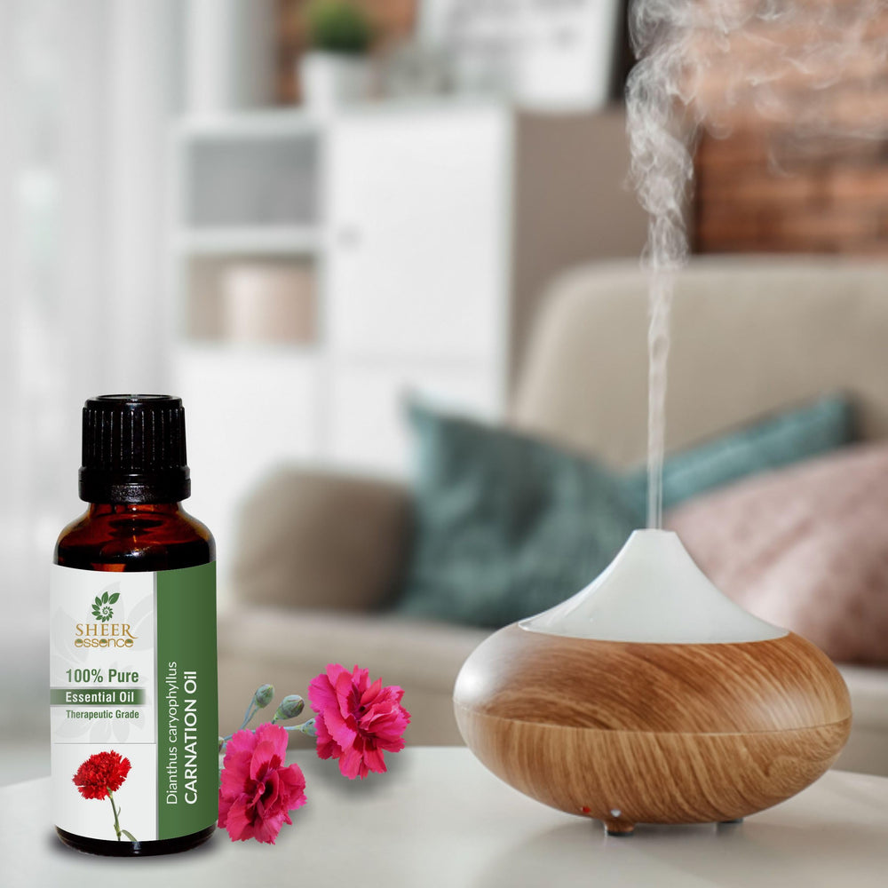 Close-up of Sheer Essence Carnation Oil packaging and label indicating purity.