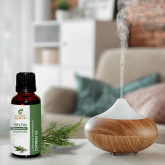 Sheer Essence Cypress Oil with bath drops suggests a relaxing bath ritual.