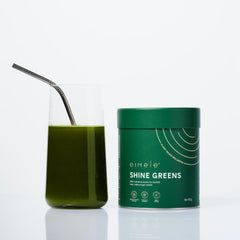 Mixing Shine Greens powder with water or a smoothie