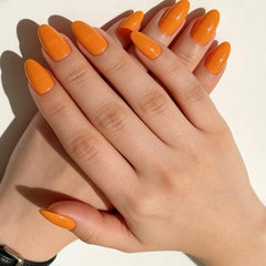 Shoindary orange press-on nails side view showing comfortable almond shape