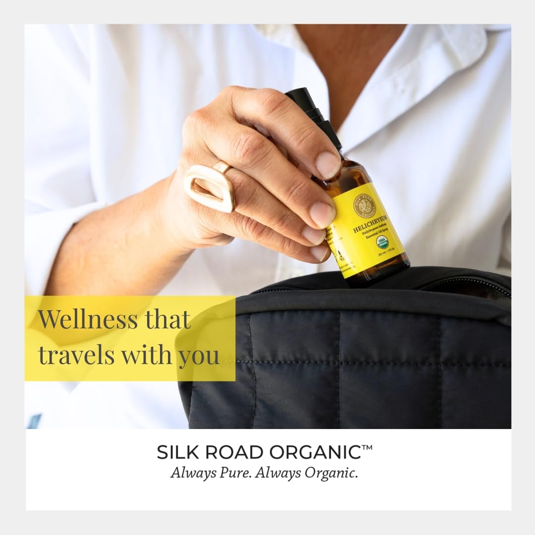 Applying Silk Road Helichrysum spray to skin after a shower.