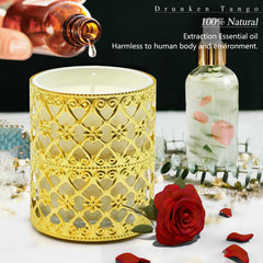 Close-up of gold candle holder and glass jar