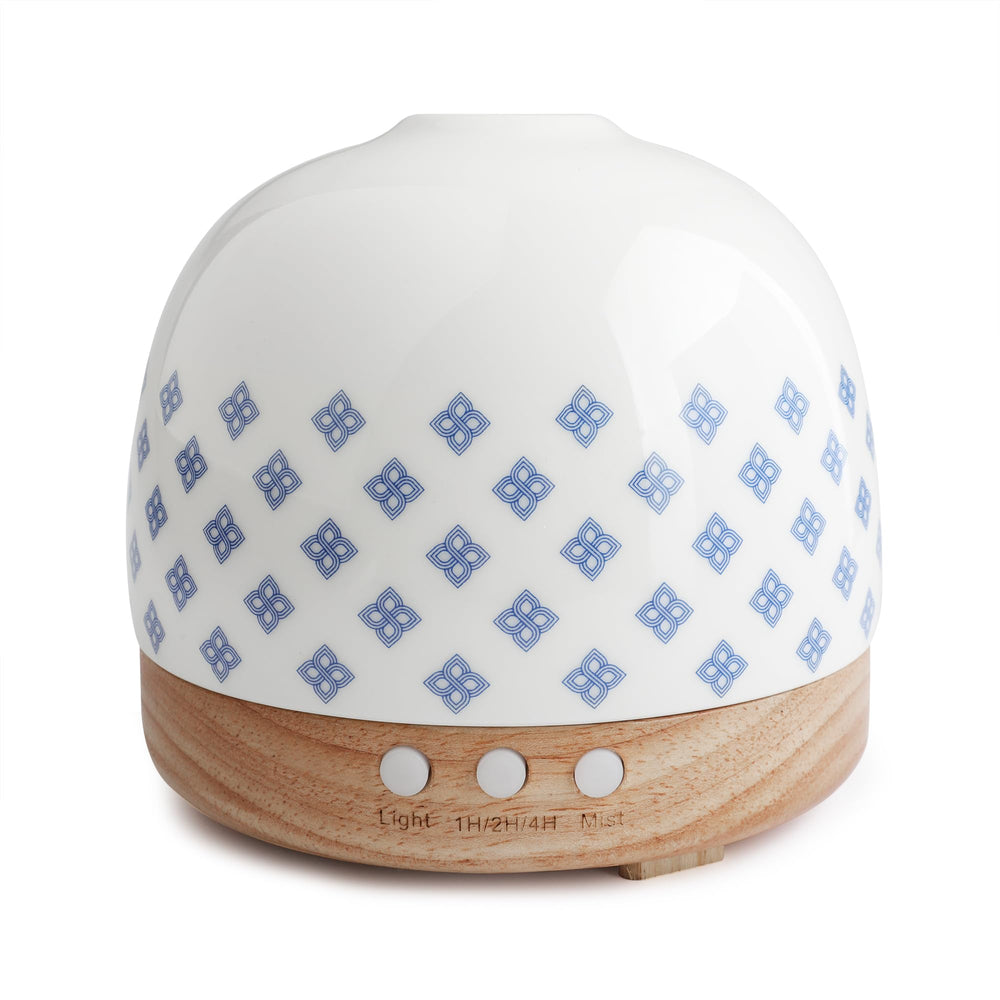 SLMIRACLE luxurious diffuser with blue porcelain pattern delivering calming aromatherapy mist for living spaces.