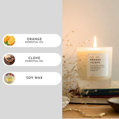 Side view of Slow North Orange + Clove Candle in frosted jar