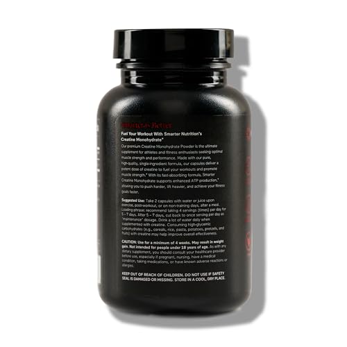 Close-up of creatine monohydrate pills and bottle