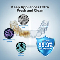 Glass of warm water showing cleaning tablet active in action