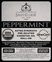 Lifestyle shot of peppermint roll-on on a desk with natural lighting