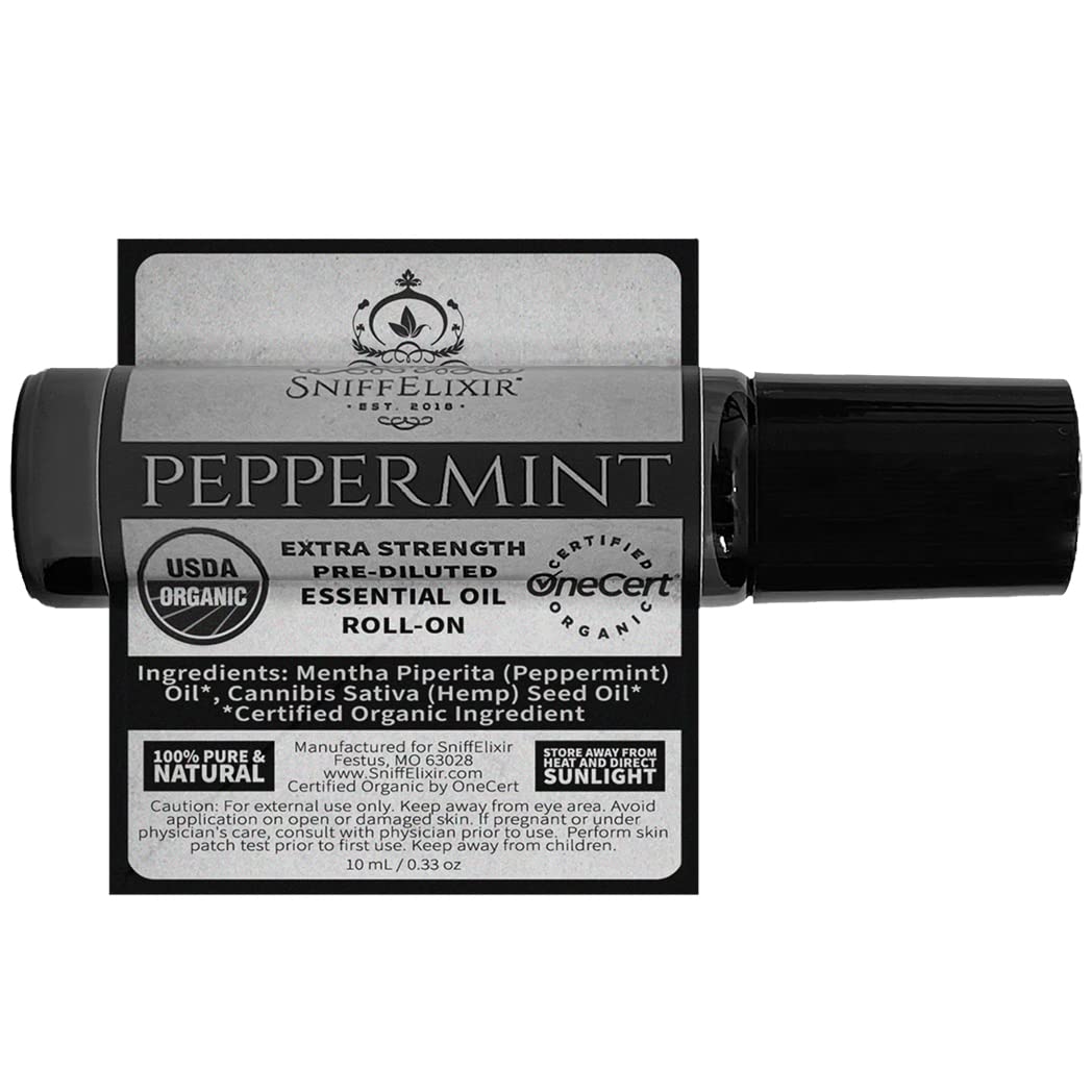 Travel-size Sniffelixir peppermint roll-on beside skincare products