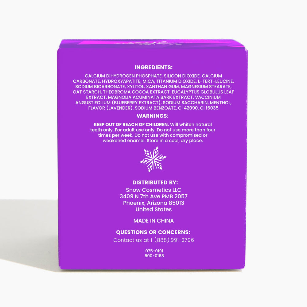 Purple color-correcting whitening powder sprinkled onto toothpaste
