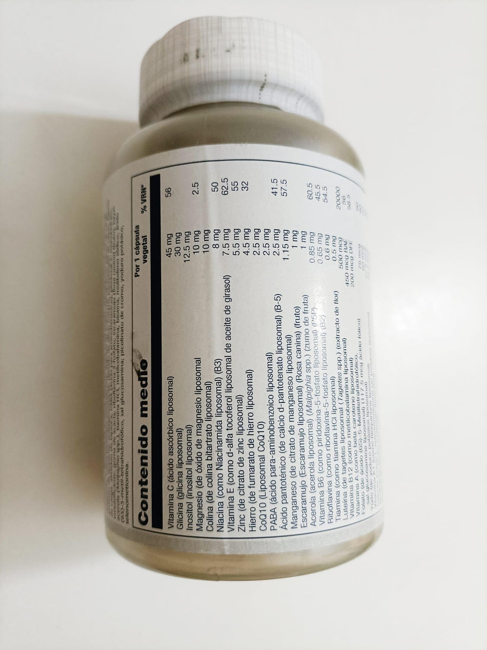 Close-up of ingredients: Vitamin C, Vitamin D, Biotin, and Methyl B-12