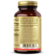 Non-GMO and vegan symbols on Solgar Vitamin E packaging