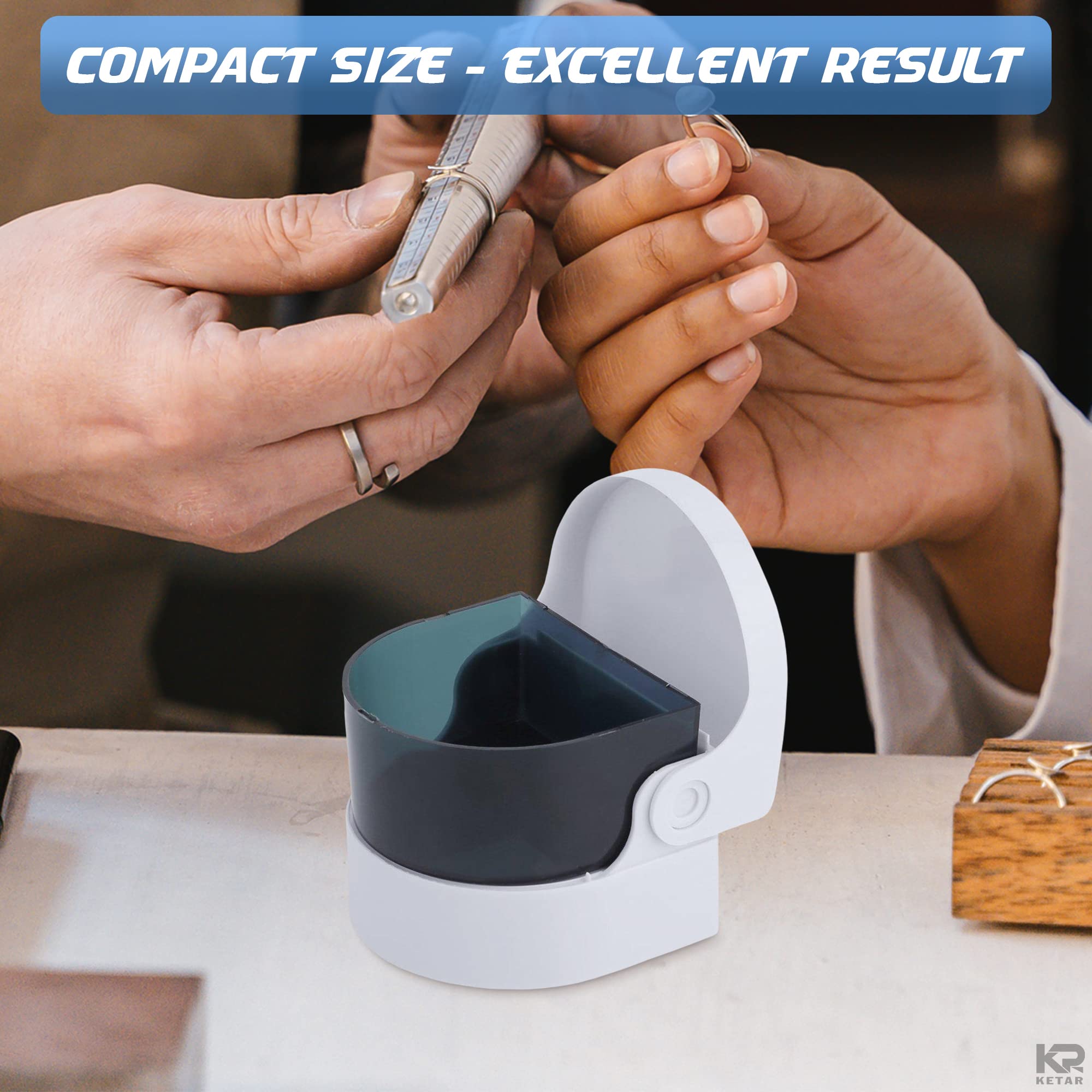 Close-up of a ring being cleaned with the device