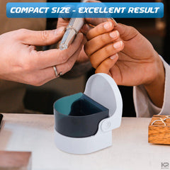Close-up of a ring being cleaned with the device