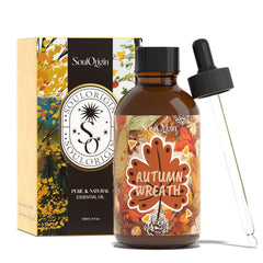 Bottle of SoulOrigin Autumn Wreath Essential Oil 120ml with autumn leaves