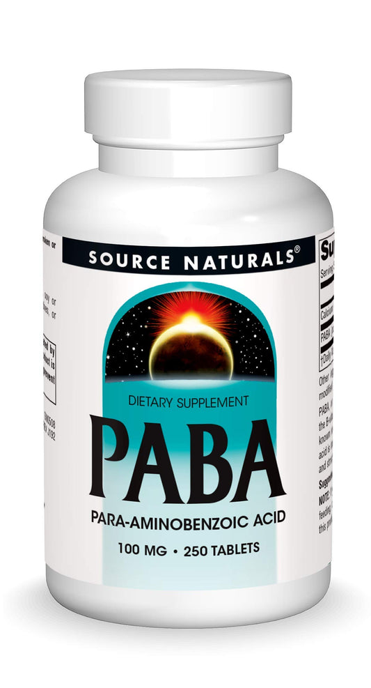 Bottle of Source Naturals PABA 100 mg dietary supplement and tablets on a white background