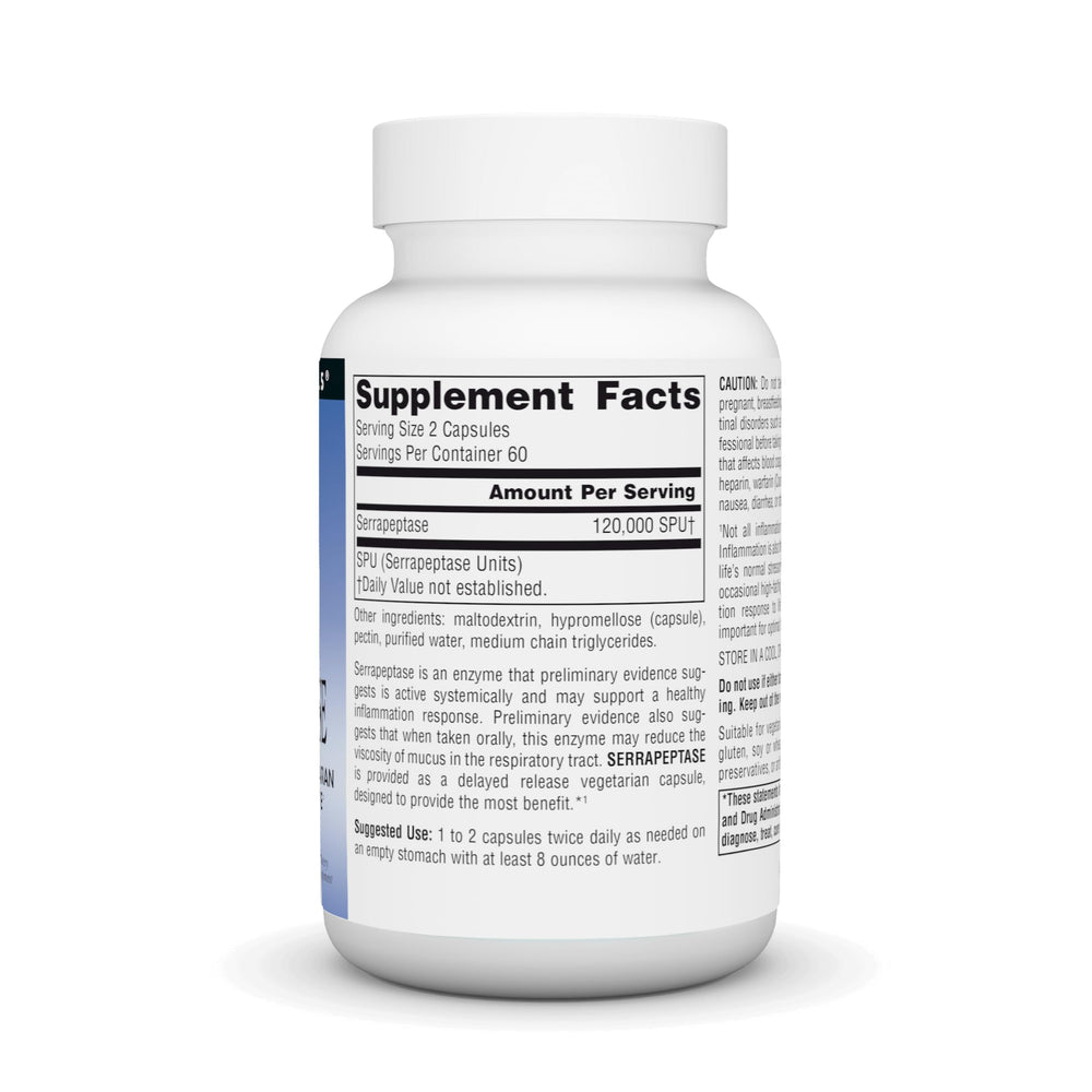 Serrapeptase capsules with glass of water