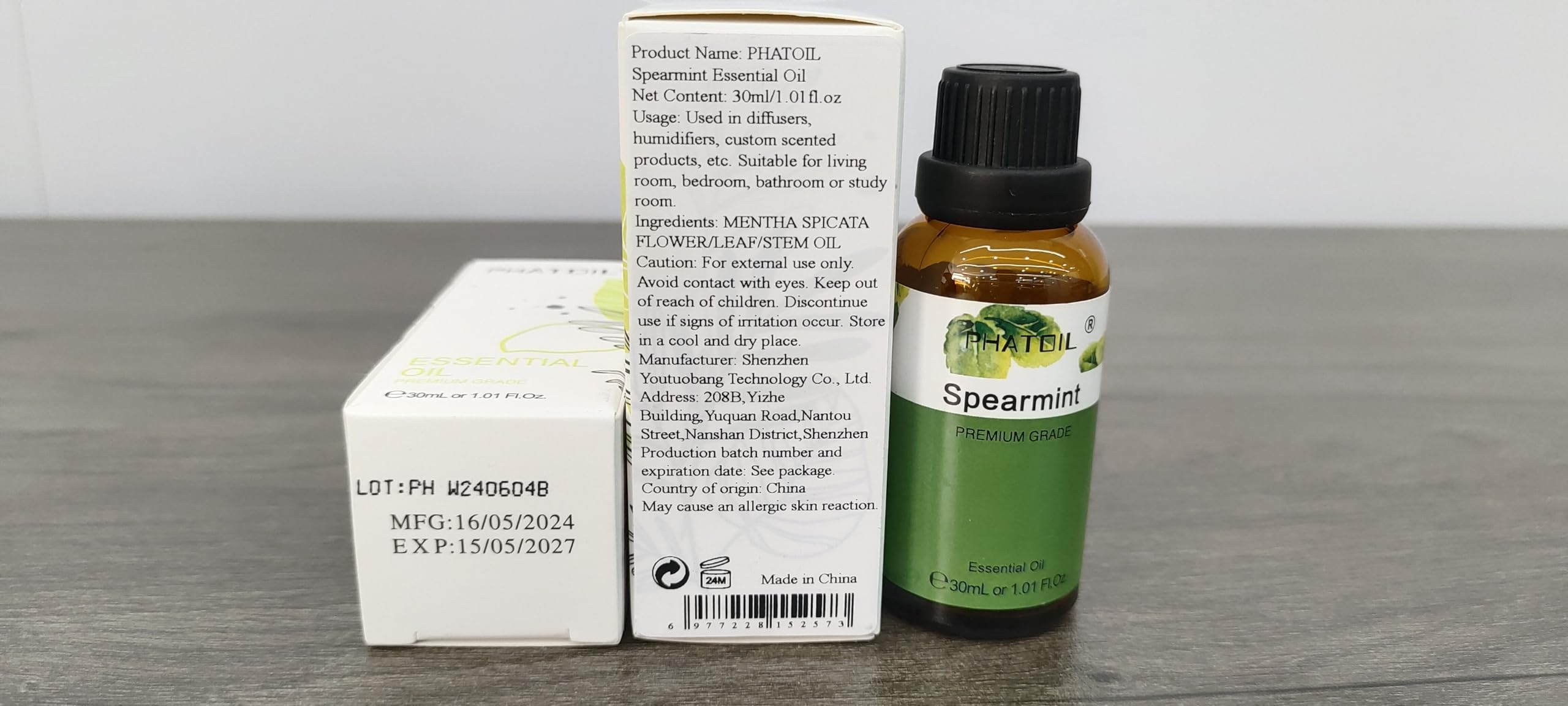 Close-up of spearmint essential oil bottle with dropper