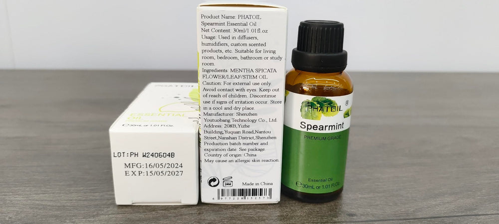 Close-up of spearmint essential oil bottle with dropper
