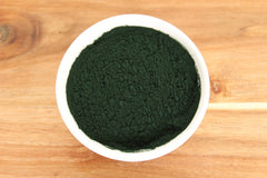 Spirulina powder being added to smoothies and desserts