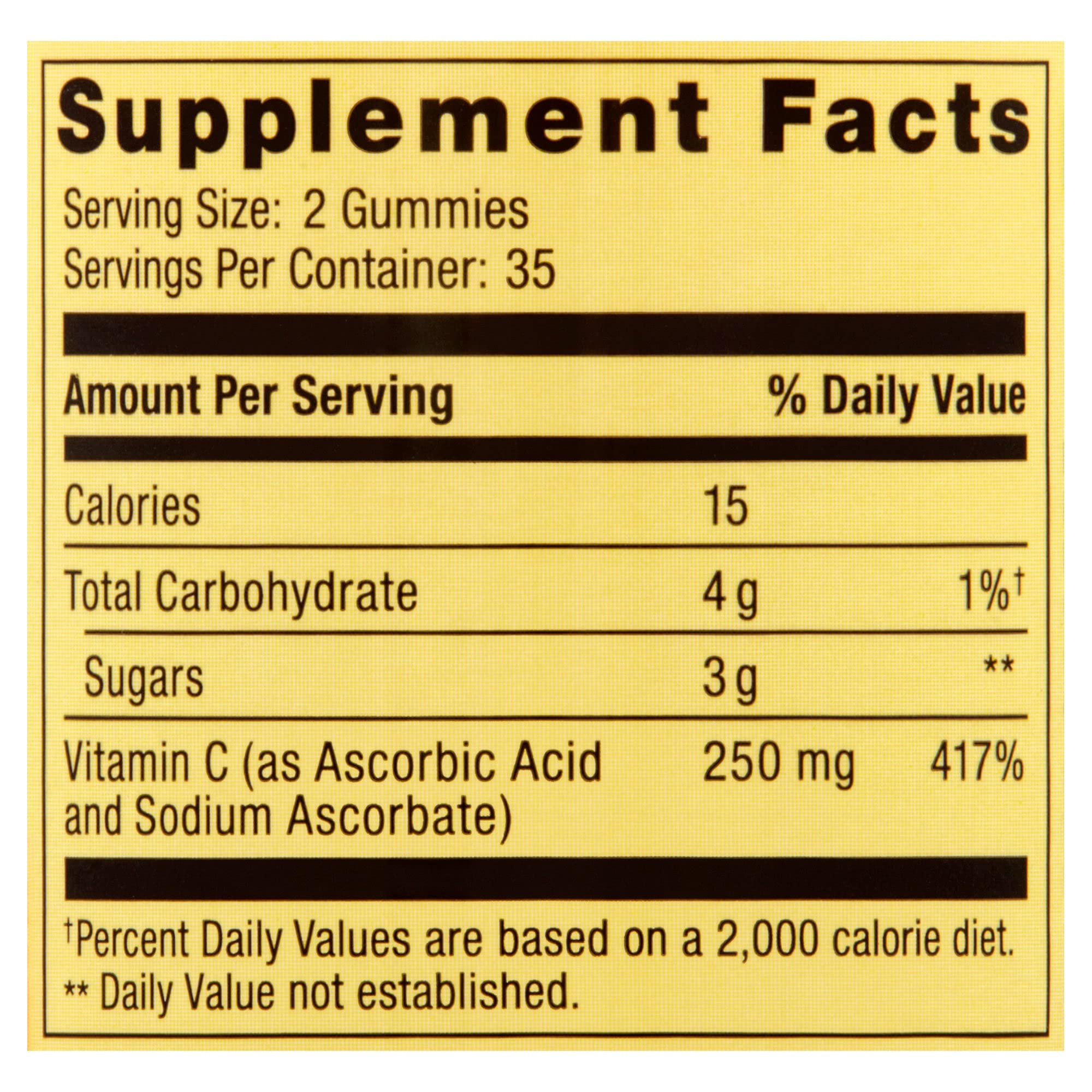 Serving of orange Vitamin C gummies next to bottle