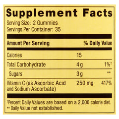 Serving of orange Vitamin C gummies next to bottle