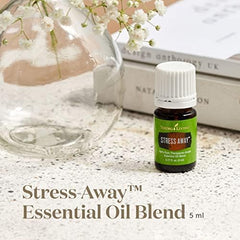 Diffuser emitting Stress Away aroma with bottle nearby