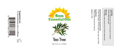 Amber glass bottle of tea tree essential oil with dropper