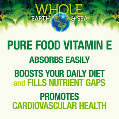 Vitamin E supplement bottle with sunflower flowers
