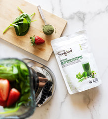 Mixing Sunfood Supergreens powder into water