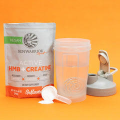 Canister with scoop and glass of water for mixing