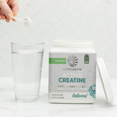 Sunwarrior Creatine Monohydrate bottle with label detailing purity and ISO testing.