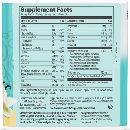 Scoop of vanilla vegan collagen-building powder beside a glass of beverage