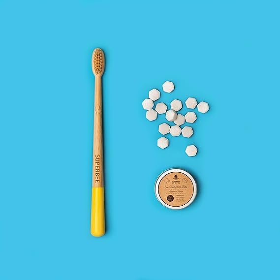 Chewing a toothpaste tablet to create paste in the mouth