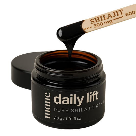 Hero image: Superior Mane Daily Lift Shilajit Resin bottle with scoop on wooden background