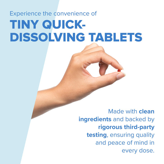Close-up of a sublingual B12 tablet dissolving under the tongue for fast absorption.