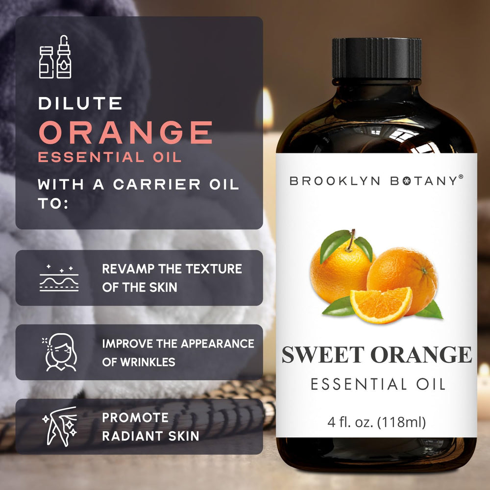 Sweet Orange Essential Oil bottle beside orange slices