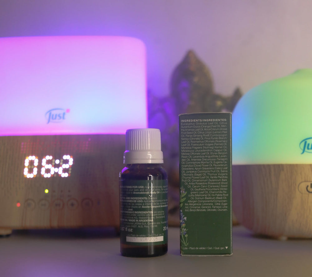 Product packaging next to bottle of Swiss Just Oil 31-20ml