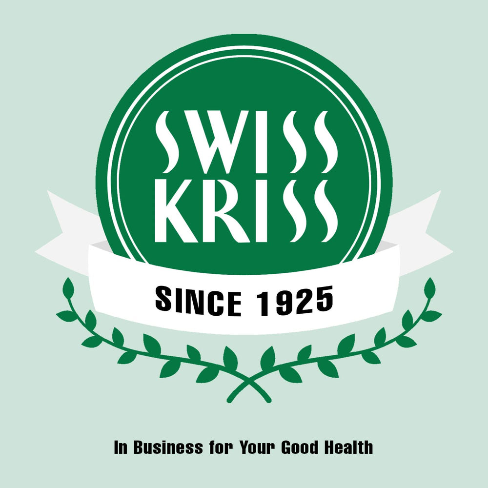 Swiss Kriss bottle beside a glass of water, ready for use.
