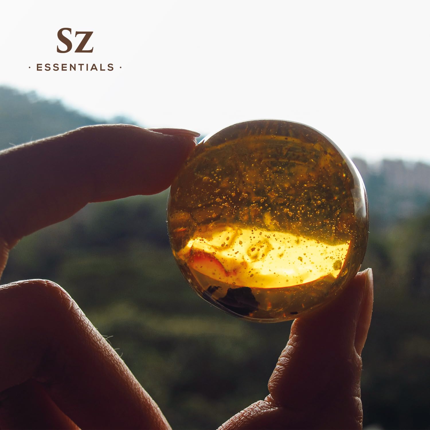 Product packaging featuring SZ Essentials branding on a dark background
