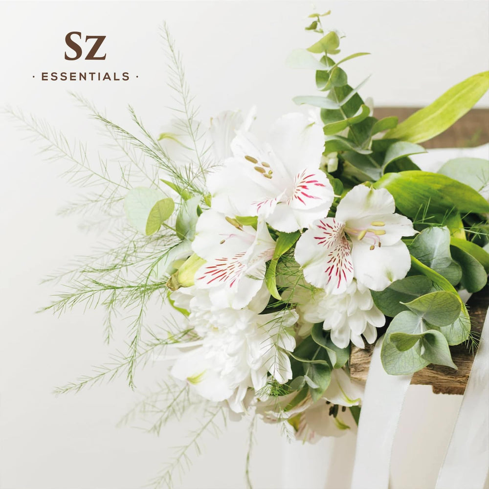 Natural perfumery blending jasmine absolute into perfume base