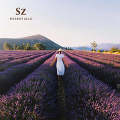 Flat lay of Kashmir Lavender Essential Oil with wooden surface