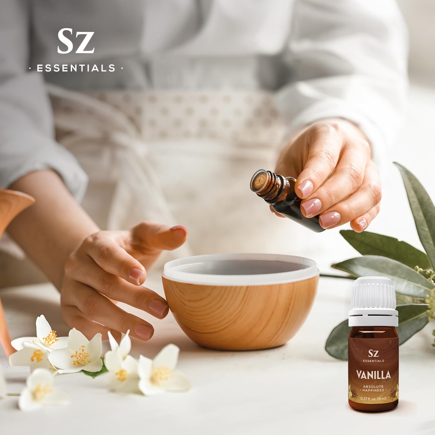 Decorative bottle containing vanilla essential oil blend